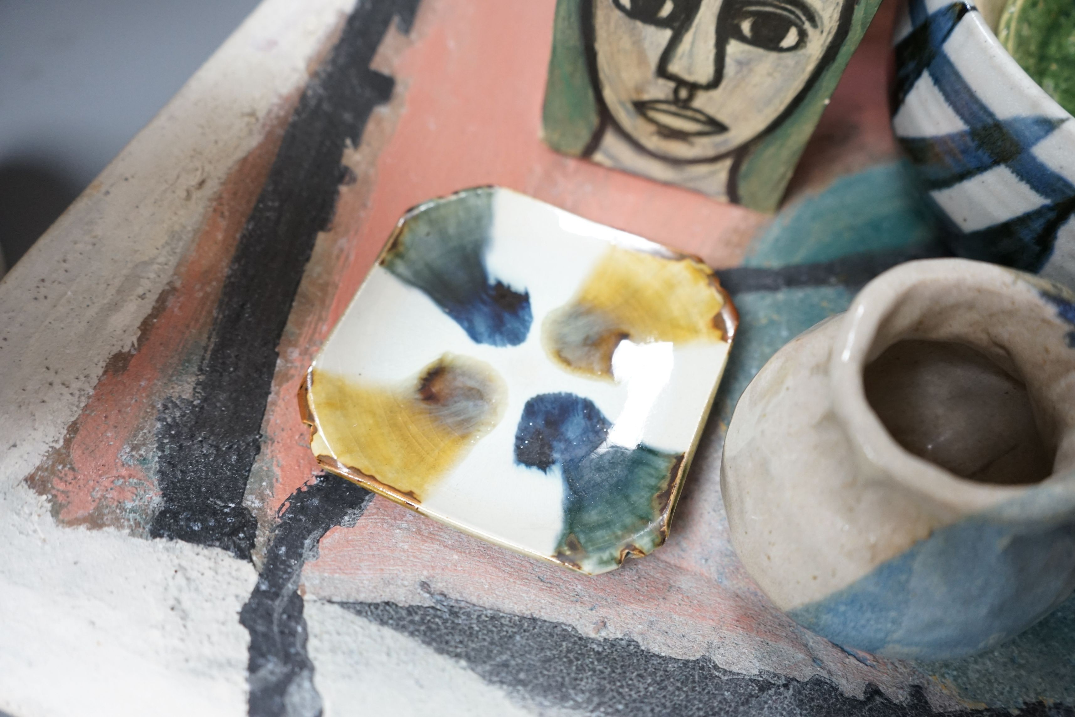 Studio pottery; a large square polychrome platter signed ‘Eastman June 87’ and a geometric vase indistinctly signed and dated 91, together with other various studio pottery wares